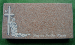 flat grave marker with couple